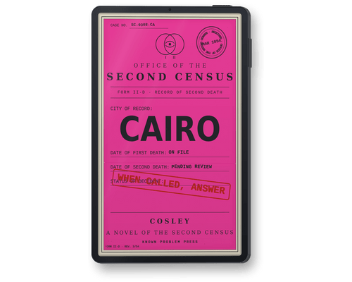 A black e-reader showing book 'Cairo: A Novel of the Second Census' by Cosley, with a bright pink front panel featuring printed text and stamps, including 'CAIRO' and a red stamp reading 'WHEN CALLED, ANSWER'.
