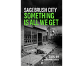 Book cover for 'Sagebrush City: Something Is All We Get' by Cosley, featuring a black and white photograph of a deserted storefront with a broken stroller on the sidewalk, with the title in bold white and green text.